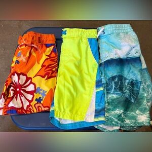 3 pair of Kids swim trunks in excellent condition. Sizes: S/4, M/8, & L/10/12.